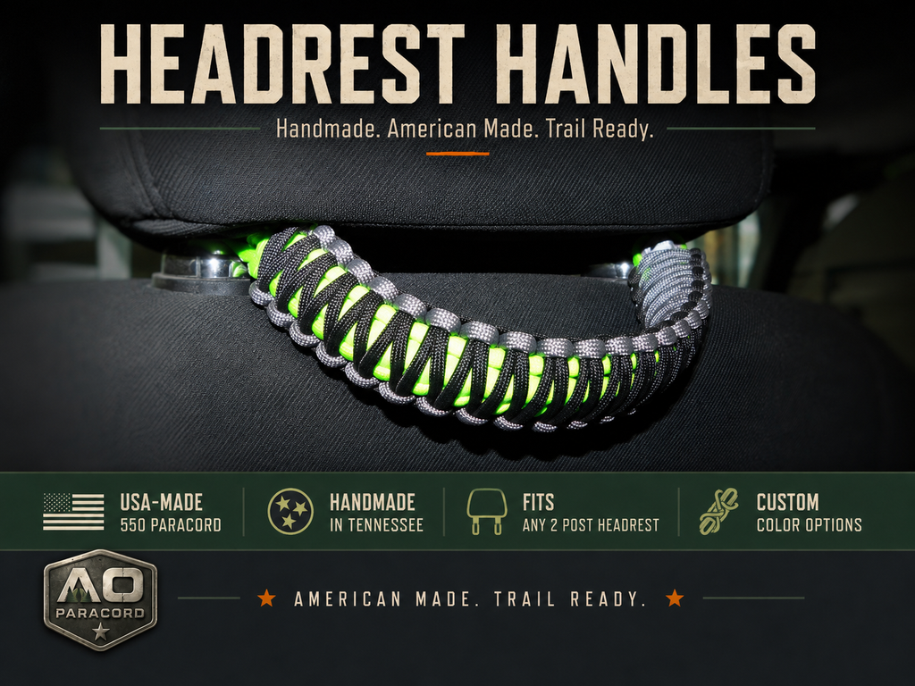 Handmade black, gray, and neon green paracord handle installed on a Jeep Wrangler or vehicle headrest, compatible with any two-post headrest.